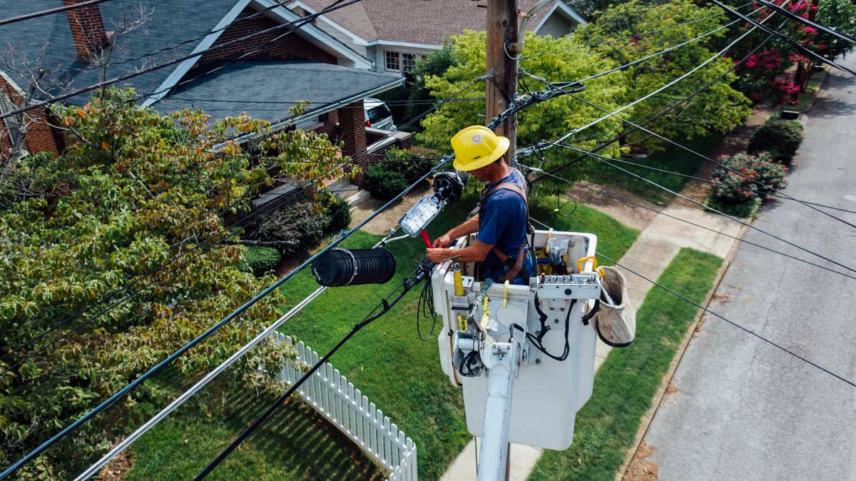 Electrician repairing concealed wiring on a wall