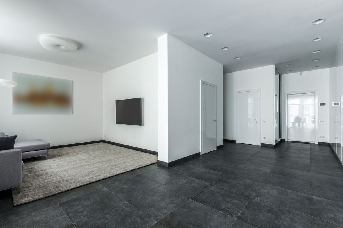 Modern living space with glossy floor tiles