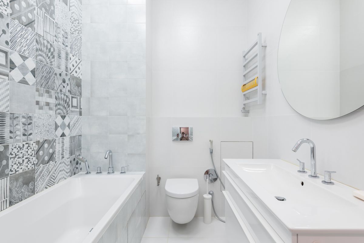 Bathroom with patterned wall tiling