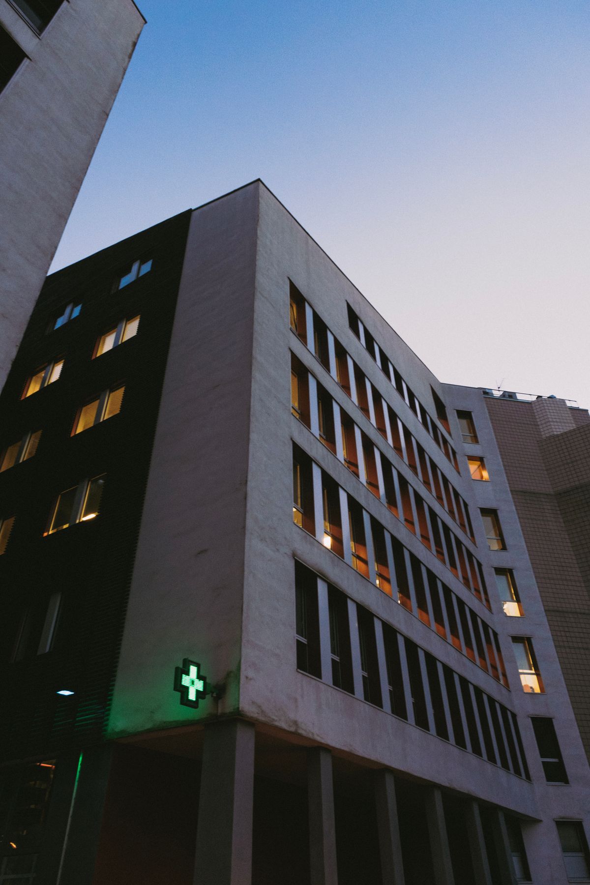 Low angle view of a hospital building at dusk